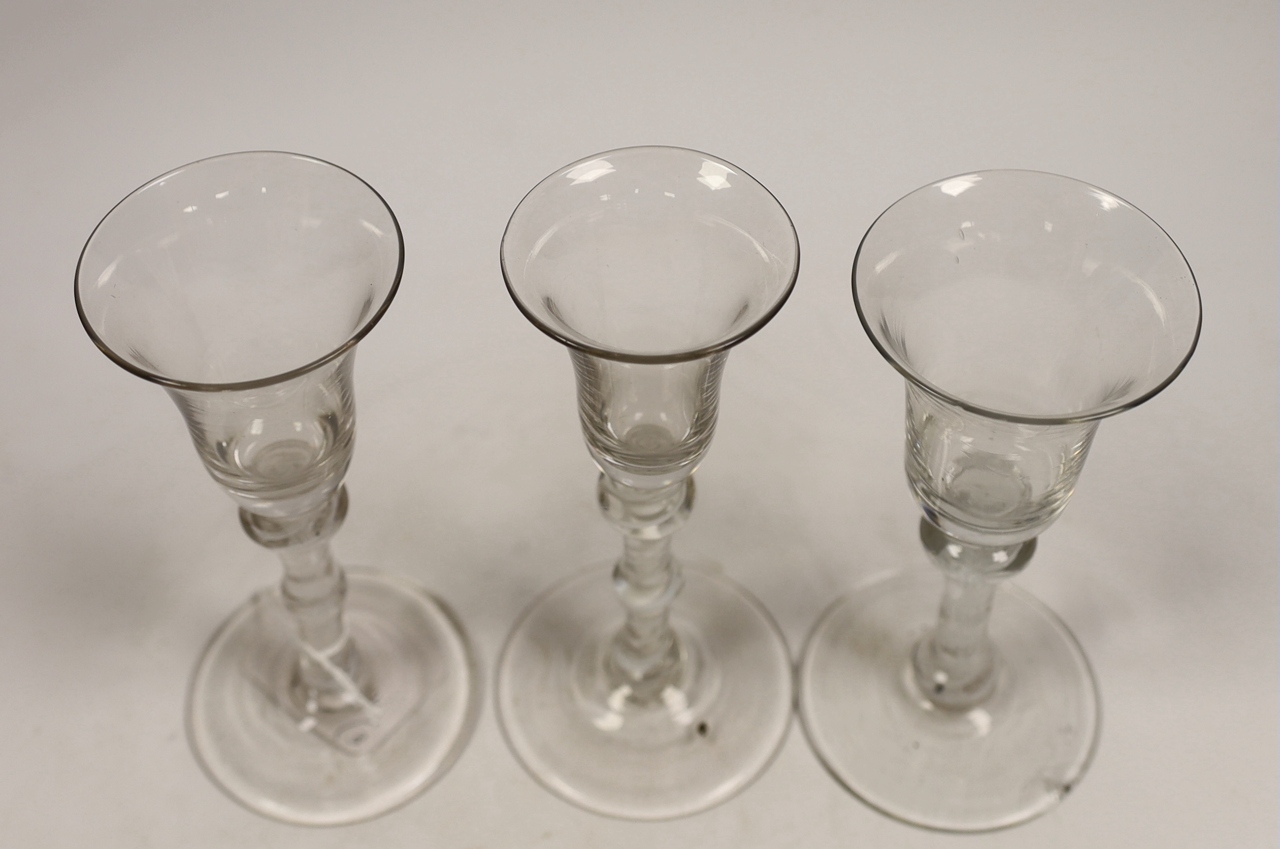 Three George III DSOT stem wine glasses, c.1760, largest 17cm high